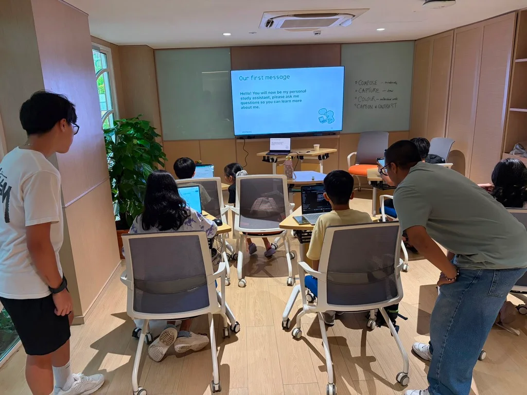 Facilitators help children try the first study-assistant prompt on their devices